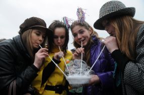 Young people inflate soap-bubbles