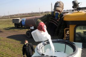 A worker fill herbicides