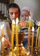 The woman puts the candle