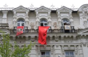 Red flag on the balcony of building