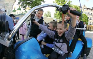 Boys sit on a motorcycle