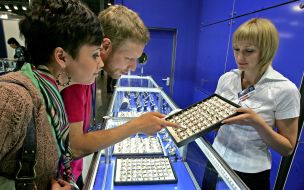 Young people examine weddings rings