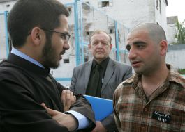 Priest with the prisoners