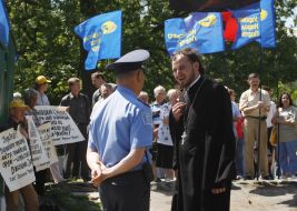 Militia employee and priest