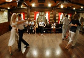 The participants of party dance  tango