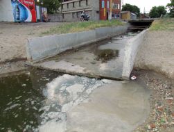 Ditch with sewers waters effluent in a sea