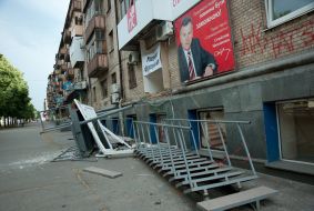 Destroyed entrance of the office of of Justice (Spravedlivost) party
