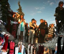 The reflection of people in a puddle 