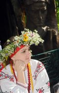 A girl wearing a crown of wild flowers