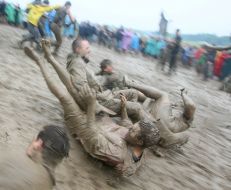 Young people, smeared with mud