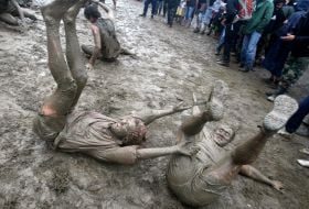 Youth, smeared with mud