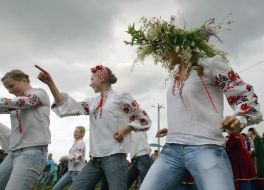 Girl in a chaplet of the field flowers