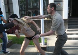 An employee of the Embassy of Georgia runs an activist of FEMEN