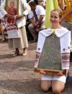 A girl holds an icon