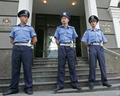 Militia officers guard the embassy of Georgia