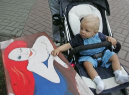 A child near an art bench