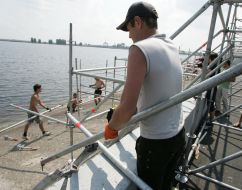 Workers assemble a tribune