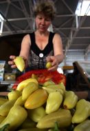 A seller puts pepper in the window