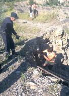 Ministry of Emergency Situations rescuer and a rescued young man