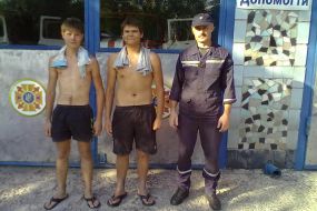 Ministry of Emergency Situations rescuer and the rescued boys