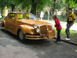 Passers-by examine a unique car