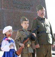 Boy and girl near soldier