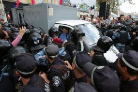 A paddy wagon with Timoshenko convoyed by "Berkut"