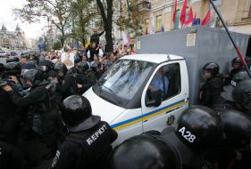 A paddy wagon with Timoshenko convoyed by "Berkut"