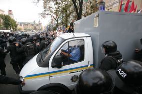A paddy wagon with Timoshenko convoyed by "Berkut"