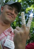 Participant of protest action against rising of price of condoms