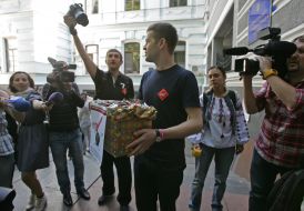 Participant of protest action against rising of price of condoms