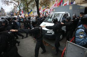 Soldiers of the special forces "Berkut" convoy a paddy wagon with Timoshenko