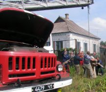 The rescuers of the Ministry of Emergency Measures pull a cow out from a technical pit