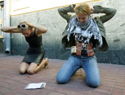 Girl shows self-made humor bomb made from sausages