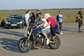 A young pair at a motor cycle