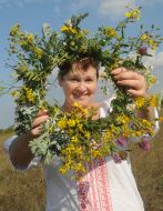 A woman holds a crown