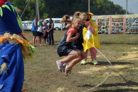 Children skip over the rope