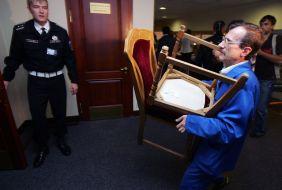 DeputiesA worker brings chairs to the hall of Kiev city council's session