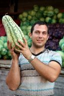 A man holds a pumpkin
