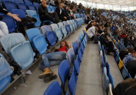 The girl lies between the rows on the podium