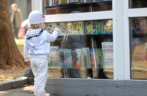 Girl examines books