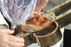 Believer kisses the cross