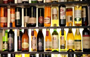 Bottles with wine in the window of shop