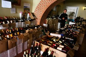 A tourist buys wine