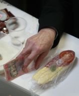 The participant of convention buys the open sandwich