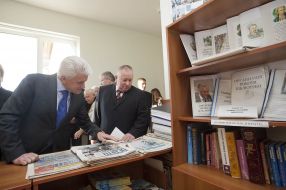 Elderly woman gives flowers to Vladimir Litvin