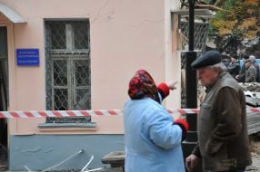 People stand near the building morgue