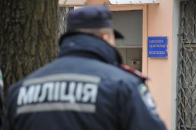 Police officer stand near the building morgue