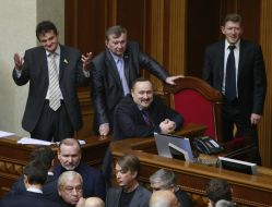 People's deputies from "BYUT-Batkivshchina" block a tribune and presidium of parliament