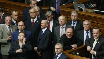 People's deputies from "BYUT-Batkivshchina" block a tribune and presidium of parliament
